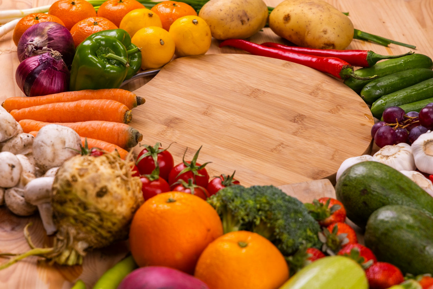 A vibrant assortment of fresh fruits and vegetables, including carrots, oranges, broccoli, and tomatoes, highlighting natural, yeast-free food options for those managing yeast intolerance.